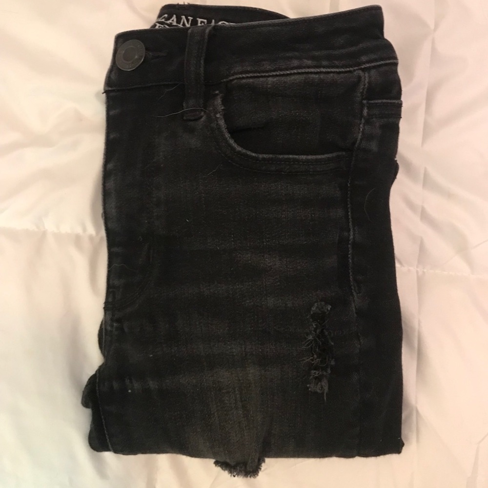 distressed black jeans